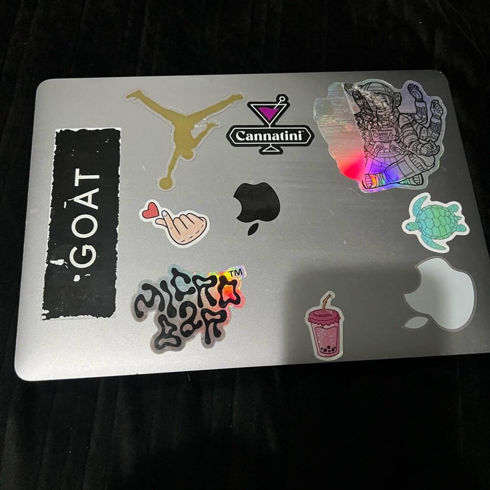 Silver MacBook Laptop with Assorted Stickers - Silver